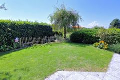 Backyard with pond at Menbergs Harmony Homestay, Hillside House