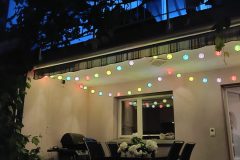 Outside dining area in backyard at nighttime